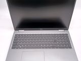 an open laptop computer sitting on top of a white table
