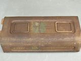 an old metal box that is sitting on a table
