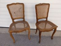 Paire de chaises dossier et assise cannés, reposant sur quat…
