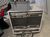 a cart with a helmet on top of it in a room