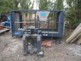 a small machine that is sitting in the middle of a field