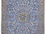 un tapis bleu avec un motif en médaillon