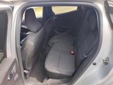 the back seats of a car are empty and the passenger seat is empty
