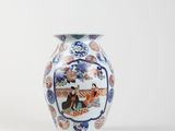 a vase with a picture of a man and a woman on it