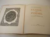 an open book with a picture of a flower inside of it