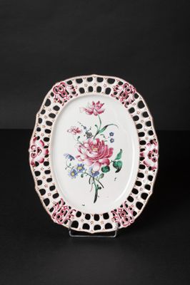 an image of a white plate with pink and blue flowers on it