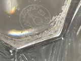 a close up view of a glass with a liquid inside of it