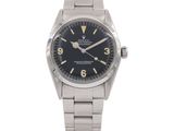 a close up of a watch on a white background with a white background