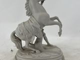 a statue of a horse with a rider on it