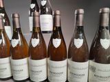 several bottles of wine are lined up on a table