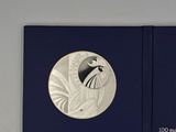 a close up of a book with a picture of a bird on it