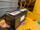 an image of a car battery in the back of a truck
