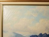 a picture of a painting of mountains in a gold frame