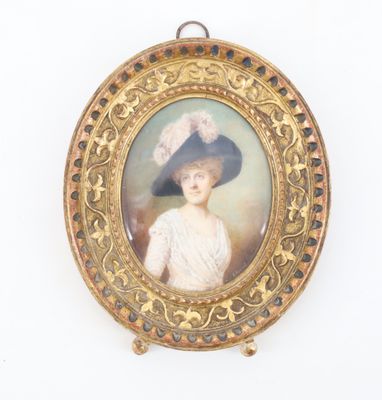 portrait of a woman in a blue hat and white dress in a gold frame