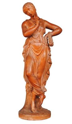 an image of a statue of a woman holding a flower