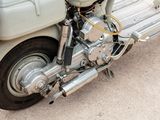 a close up of a motorcycle parked on the side of the road