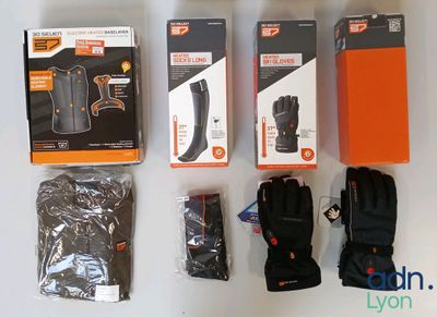 several pairs of gloves, gloves, gloves, gloves, and other items laid out on a table