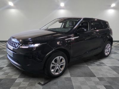 a picture of a black land rover parked in a garage