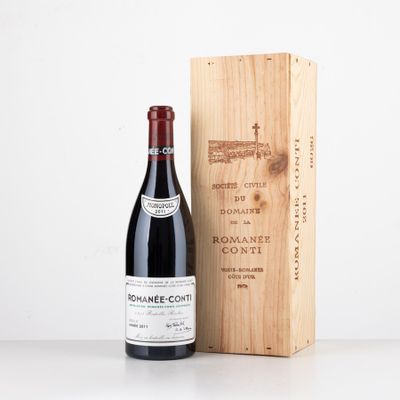 a bottle of wine next to a wooden box