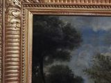 an image of a painting of a wooded landscape with a man on a horse
