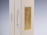 an image of a white box with a gold label on it