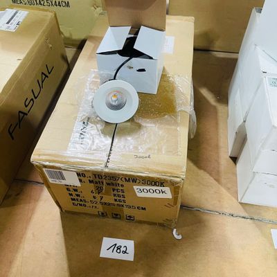 a box with a toilet and a toilet paper dispenser on it