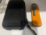 a black case with a yellow object next to it