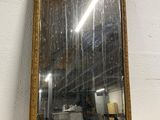 an image of a mirror sitting on top of a white wall