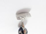 sterling silver ring with a blue and brown stone in the center