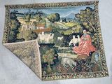 a rug with a picture of a woman and sheep on it