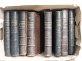 many old books in a box on the shelf