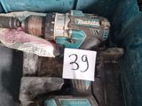 a small tool in a blue box with a price tag on it