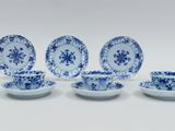 six pieces of blue and white porcelain dishes and cups and saucers