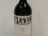 a bottle of wine that is sitting on a table