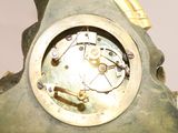 a close up of a clock on a table