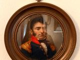a painting of a man in a military uniform on a wall