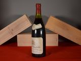a bottle of wine that is sitting on a table