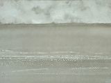 a painting of a surfer riding a wave in the ocean
