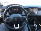 the interior of a car with a steering wheel and dashboard controls