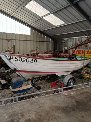 a boat that is sitting on a trailer in a garage