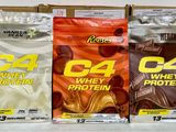 three bags of whey protein sitting on top of a counter