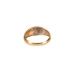 a close up of a gold ring on a white background