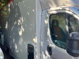 two vans parked next to each other in a parking lot