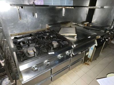an image of a commercial kitchen with stainless steel appliances