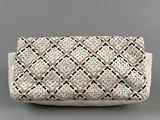 a white clutch bag with a woven design on the front