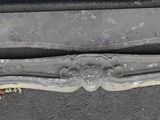 a close up of a bench on the side of the road