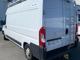 a white van that is parked in a parking lot