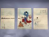 three asian paintings on a wall in a room with a blue wall