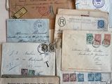 a lot of old letters and envelopes on the table