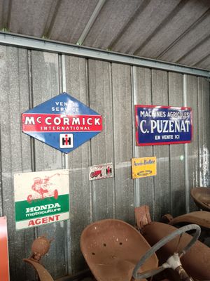 many different signs on the wall of a building